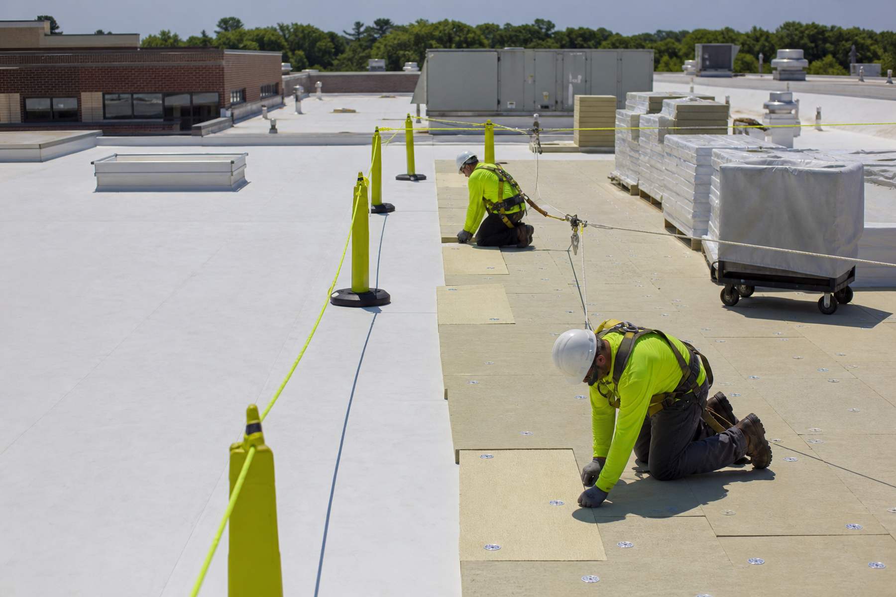 Quantum crew working on a schools and public facilities roof